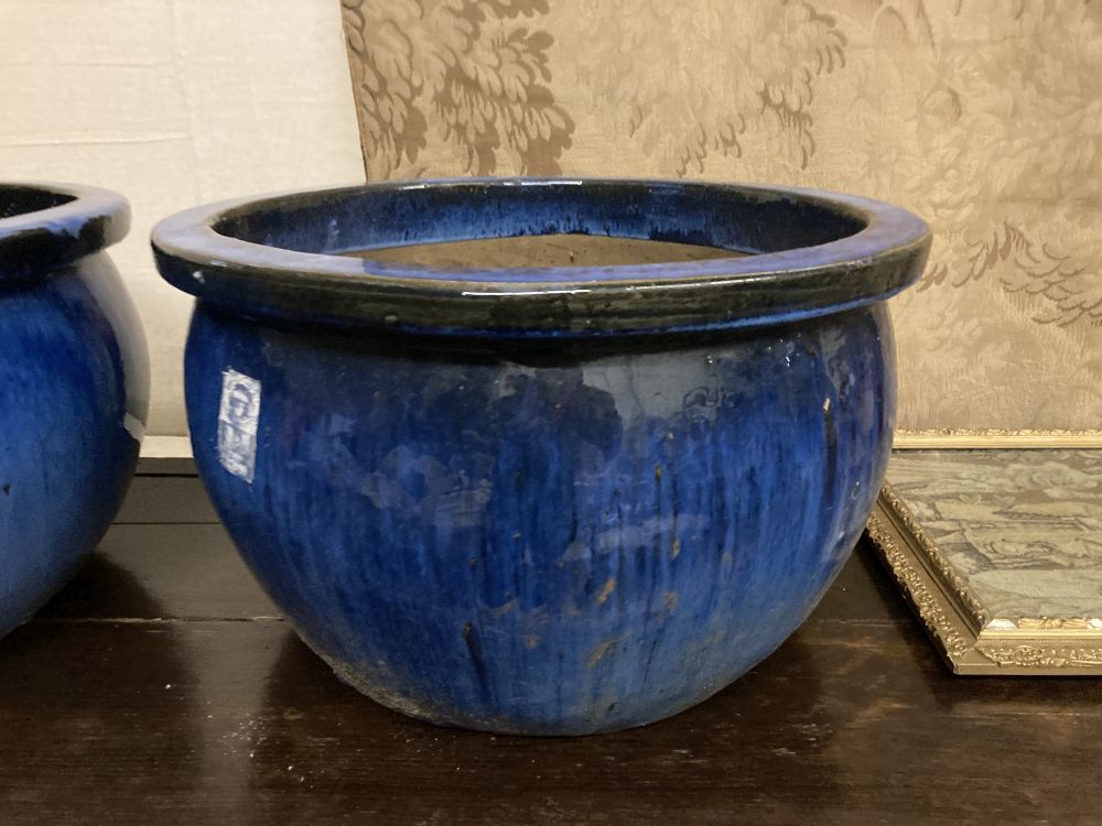 A pair of circular blue glazed garden planters, diameter 52cm, height 30cm